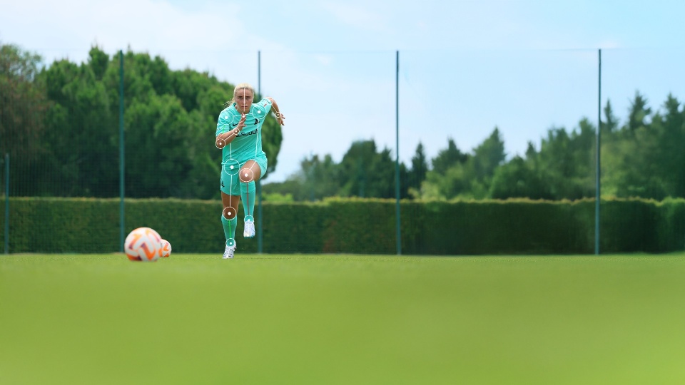 Image from ai.i. Footballer sprinting with vector lines on them