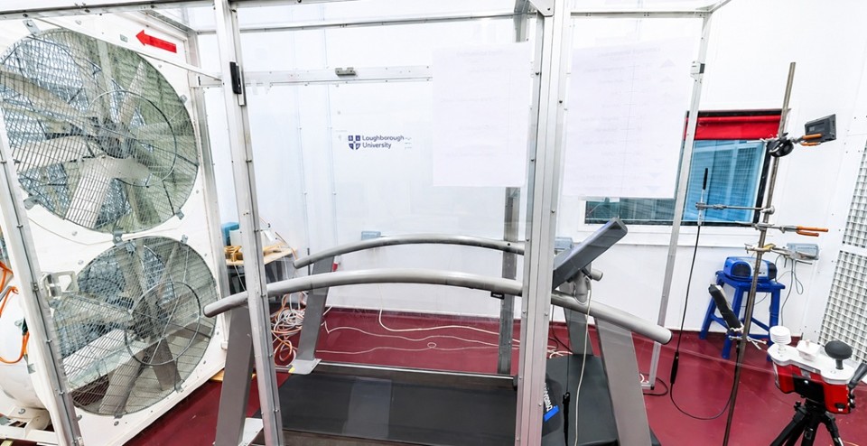A treadmill with two large fans behind it. This is the climate chambers at Loughborough Unviersity.