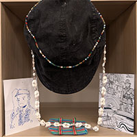 A cap, postcards and necklaces