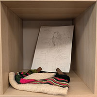 A fabric bag and hand drawn comic page