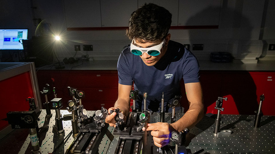 Researcher working in photonics lab