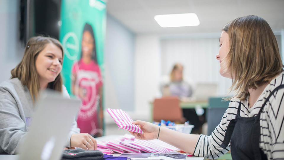 Students talking in Student Services area