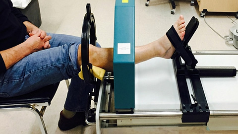 A leg in a brace being scanned