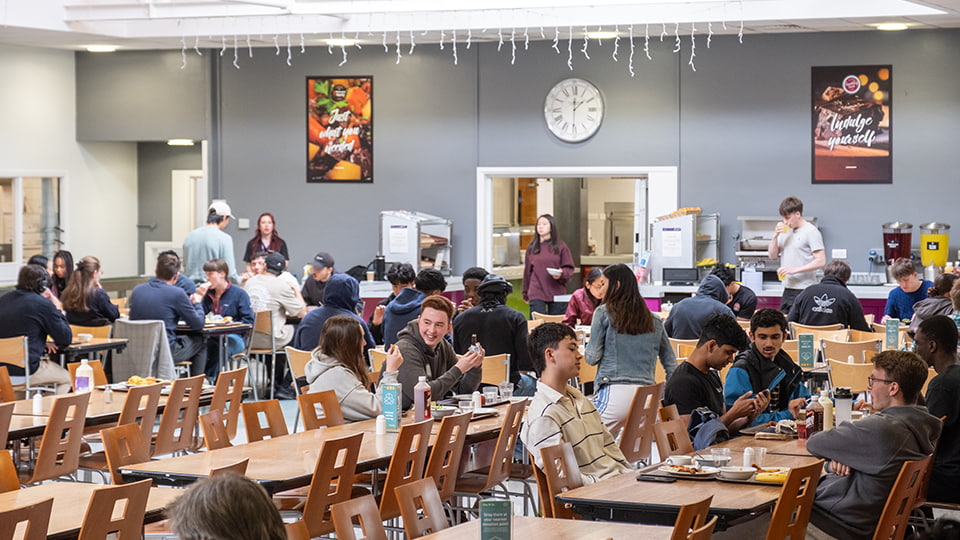 Elvyn Richards dining hall with rows of tables with students eating meals
