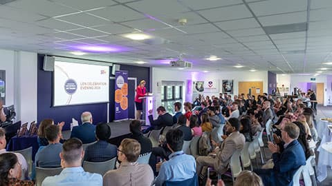 Pro-Vice Chancellor for Education and Student Experience, Professor Rachel Thomson on stage at the LEN celebration event talking to the audience/attendees at University Stadium, Loughborough University.