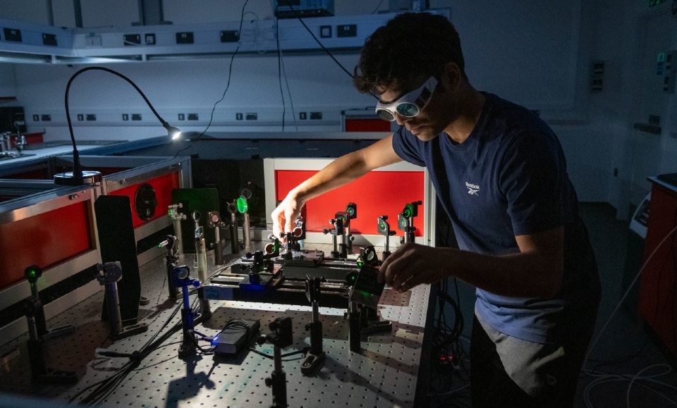 A researcher in the Emergent Photonics Research Centre