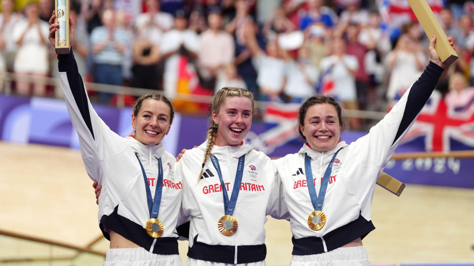 Great Britain's Katy Marchant, Emma Finucane and Sophie Capewell celebrate with their gold medals won in the Women's Team Sprint finals