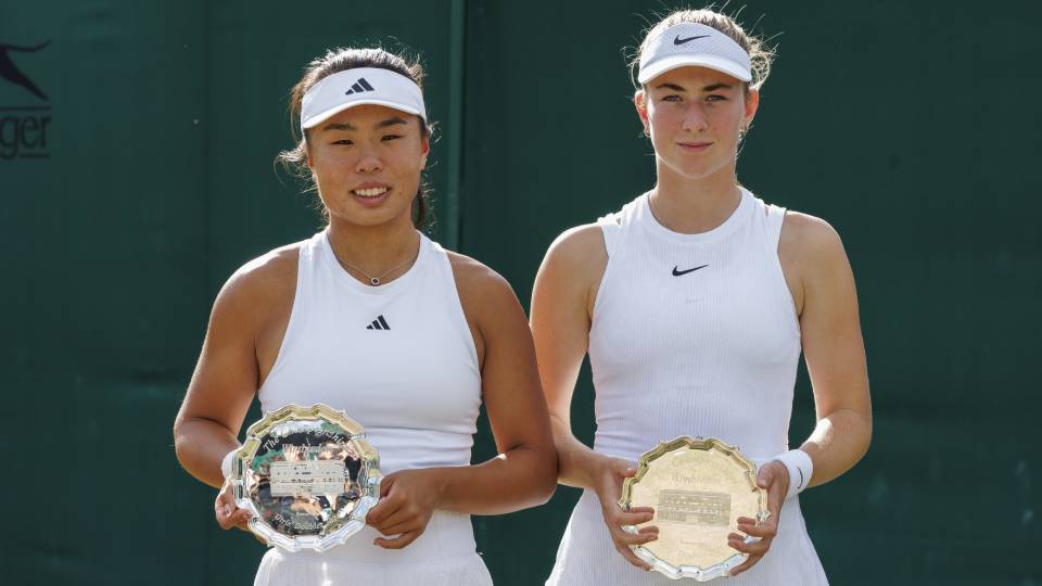 tennis players Mimi Xu and Mika Stojsavljevic holding a runners-up trophy