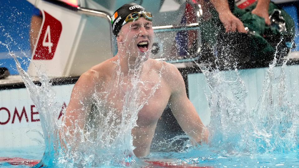 swimmer Daniel Wiffen celebrates winning a race