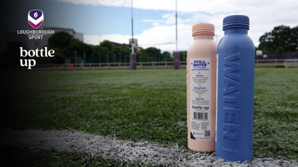 water bottles in front of a rugby pitch