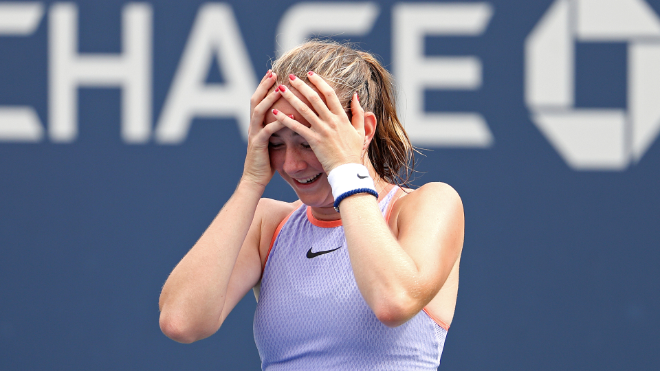 a girl holding her head in her hands in disbelief