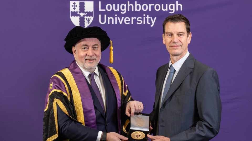 Professor Scott Lockyer being presented his University medal by Loughborough's Vice-Chancellor and President Professor Nick Jennings