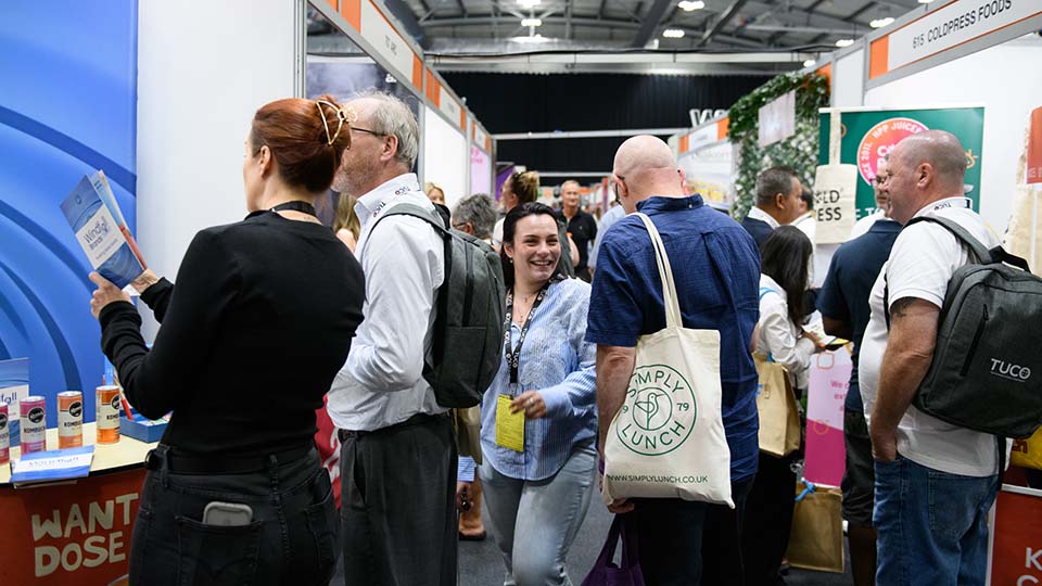 A group of people networking at the 2025 TUCO Summer Conference.