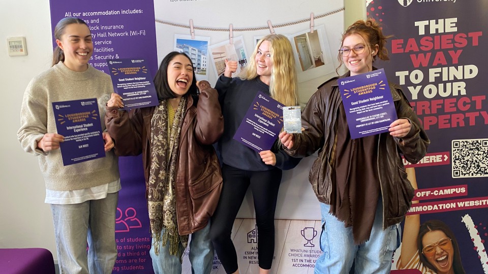 Four students standing together holding certificates at the Loughborough Studentpad Awards evening.