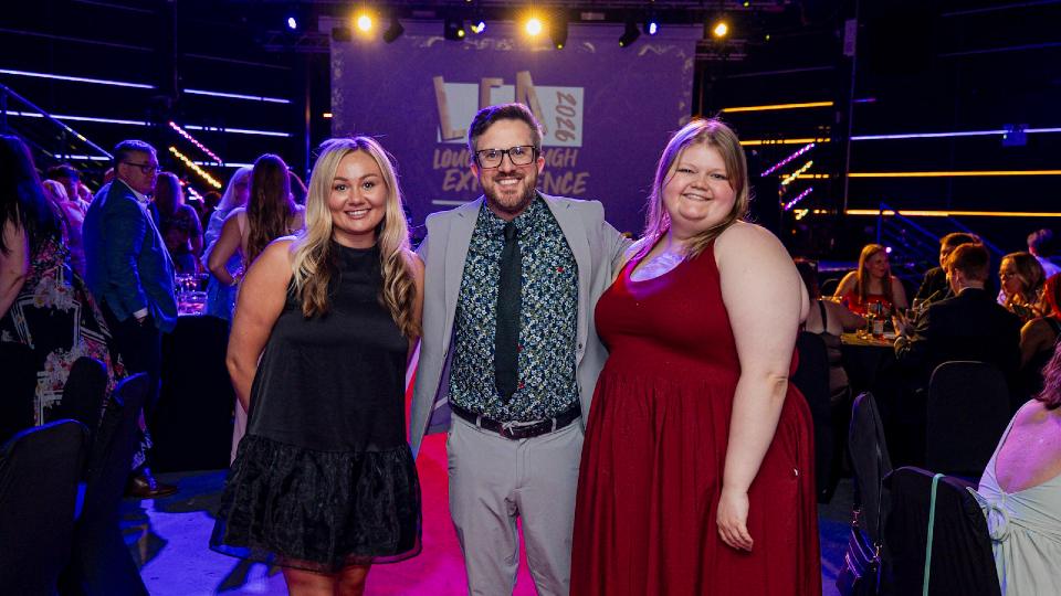 Three members of staff standing together at the 2026 Loughborough Experience Awards.